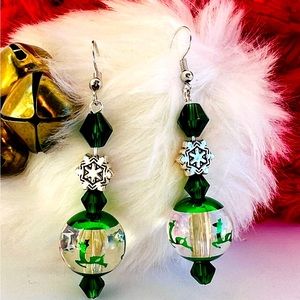Green glass reindeer ornament earrings with snowflake accent. $10